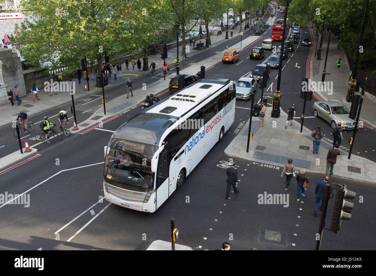 London, England - May 24, 2016: A National Express coach on the Embankment road near Westminster in central London. Stock Photo