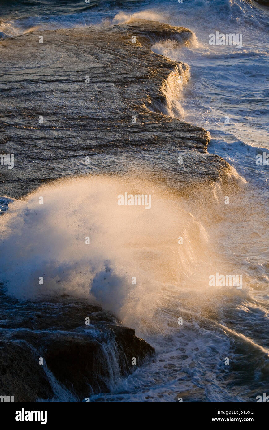 The coastline on the Peninsula Valdes. Waves crashing against the rocks. Argentina. Stock Photo