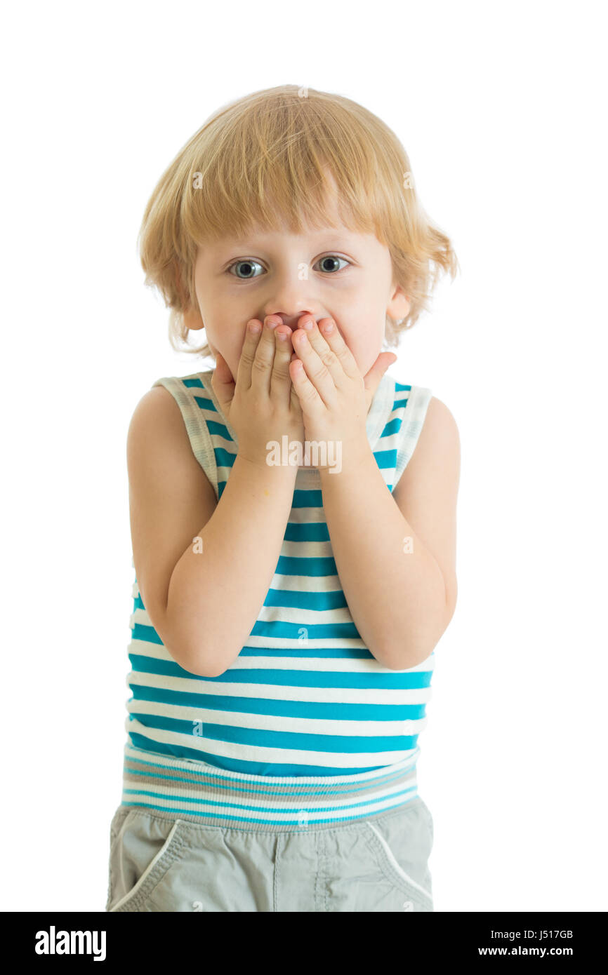 Surprised little boy with hands closed his face Stock Photo