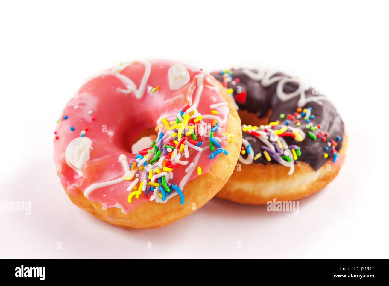Donut with colorful sprinkles isolated on white Stock Photo - Alamy