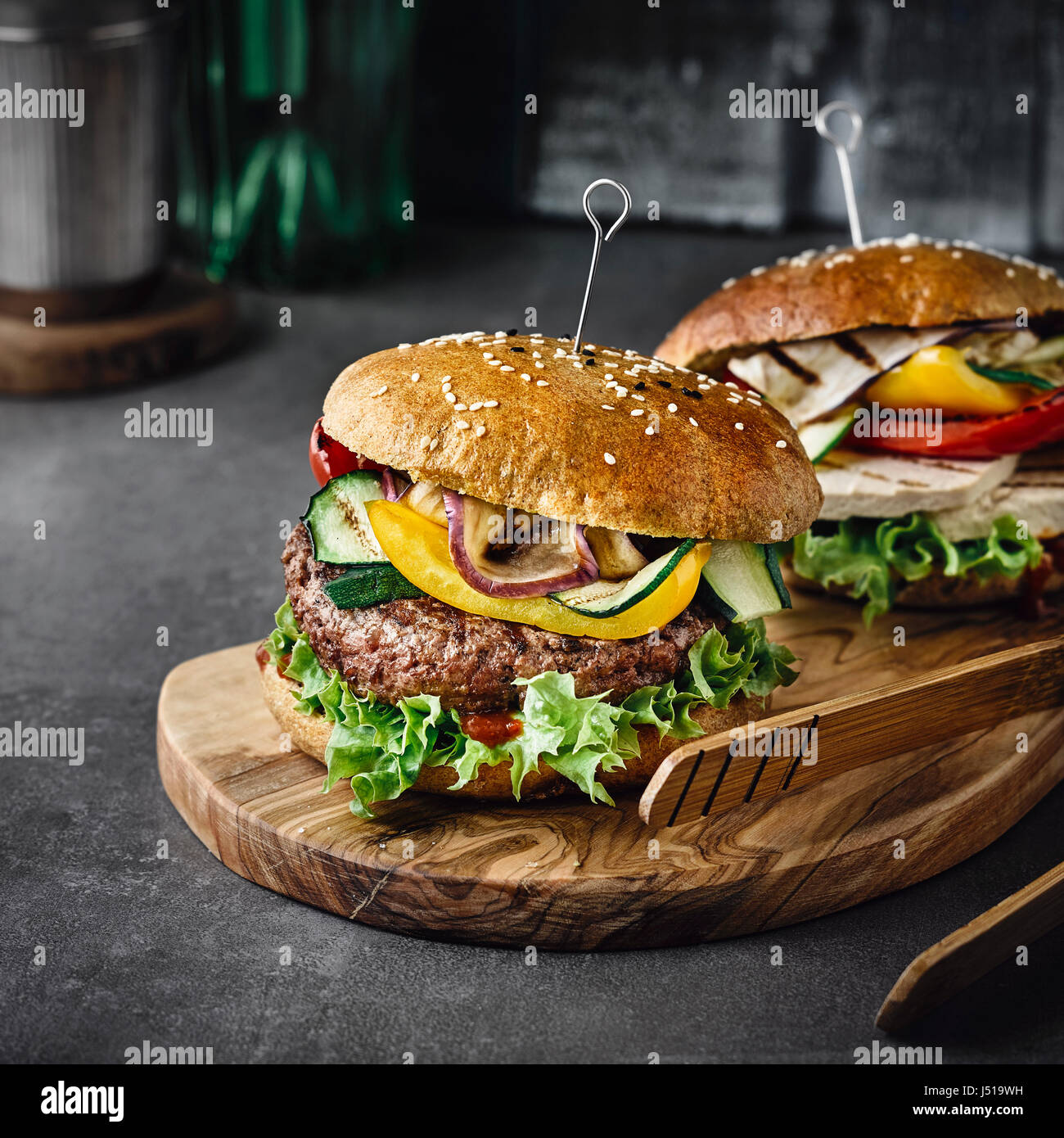 Beef burger and tofu variety with grilled vegetables Stock Photo