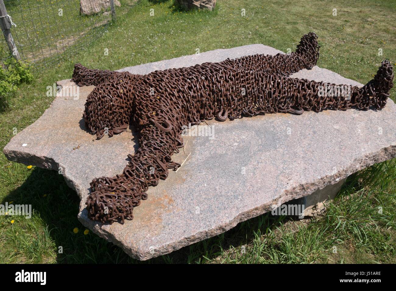 A sculpture of a human form, in chains,at Big Stone Mini Golf and