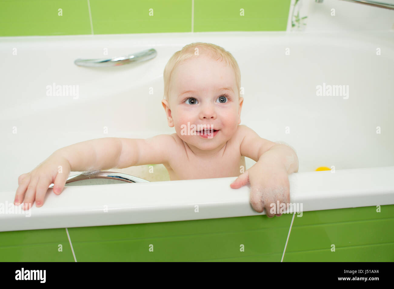 Boy bathing in bathtub hires stock photography and images Alamy