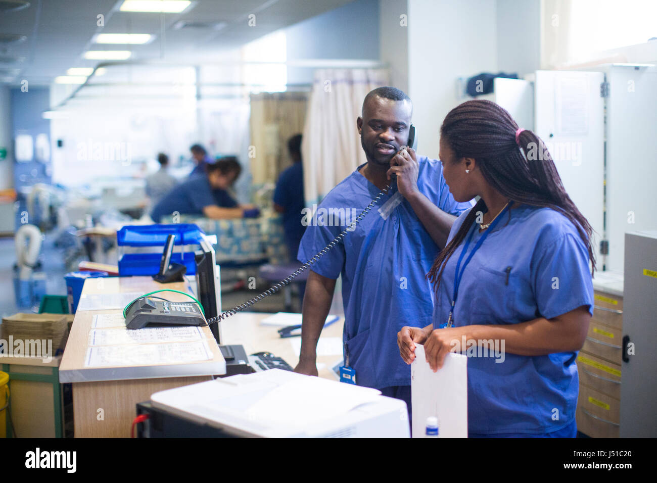 Doctors and nurses working in a hospital in ward and operating theatre ...