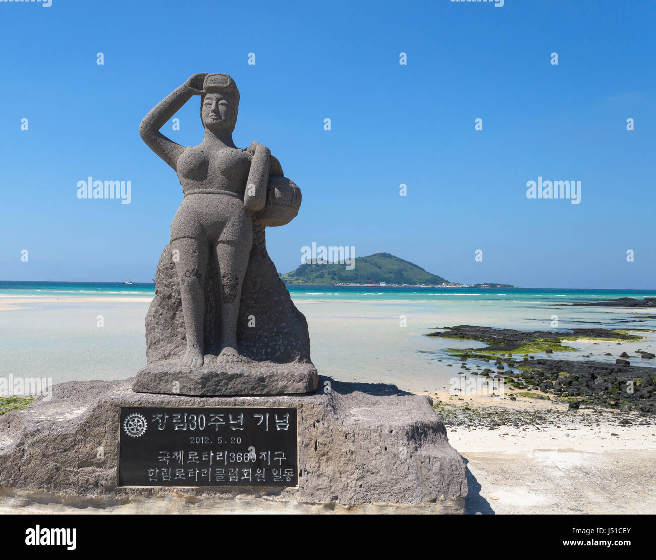 Haenyeo statue on the beach at Jeju island Stock Photo Alamy