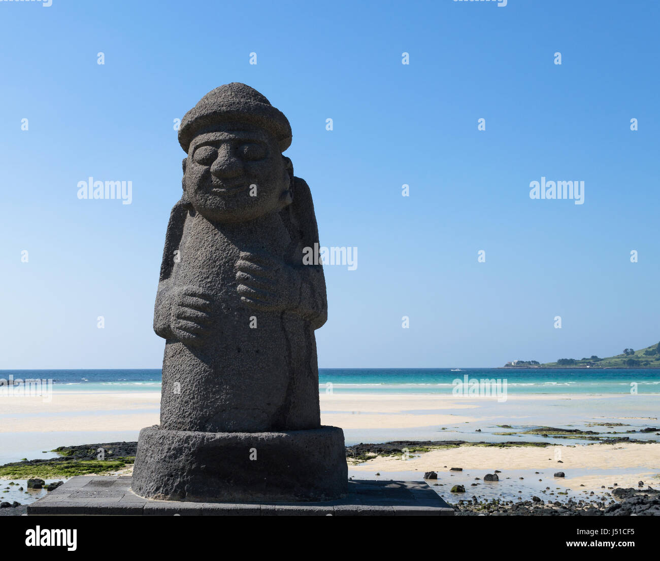 Dol hareubang statue on the beach at Jeju island symbol of Jeju island ...