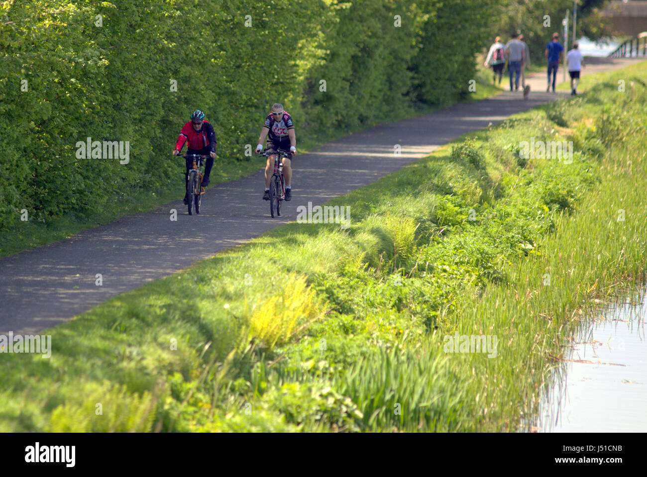 Forth and Clyde canal tow path two male cyclists Stock Photo