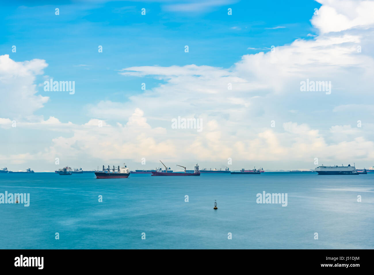 Singapore Seascape From Marina Barrage with Cargo ship at port and nice sky with cloud Stock Photo