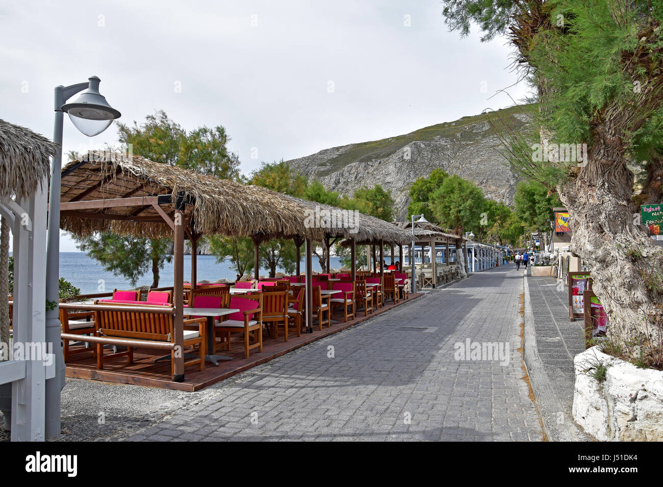 Street view of seafront restaurant hotels in Kamari, Santorini, Greece Stock Photo
