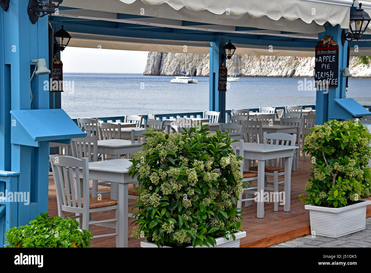 Restaurant overlooking Kamari Beach in Santorini Greece Stock Photo Alamy