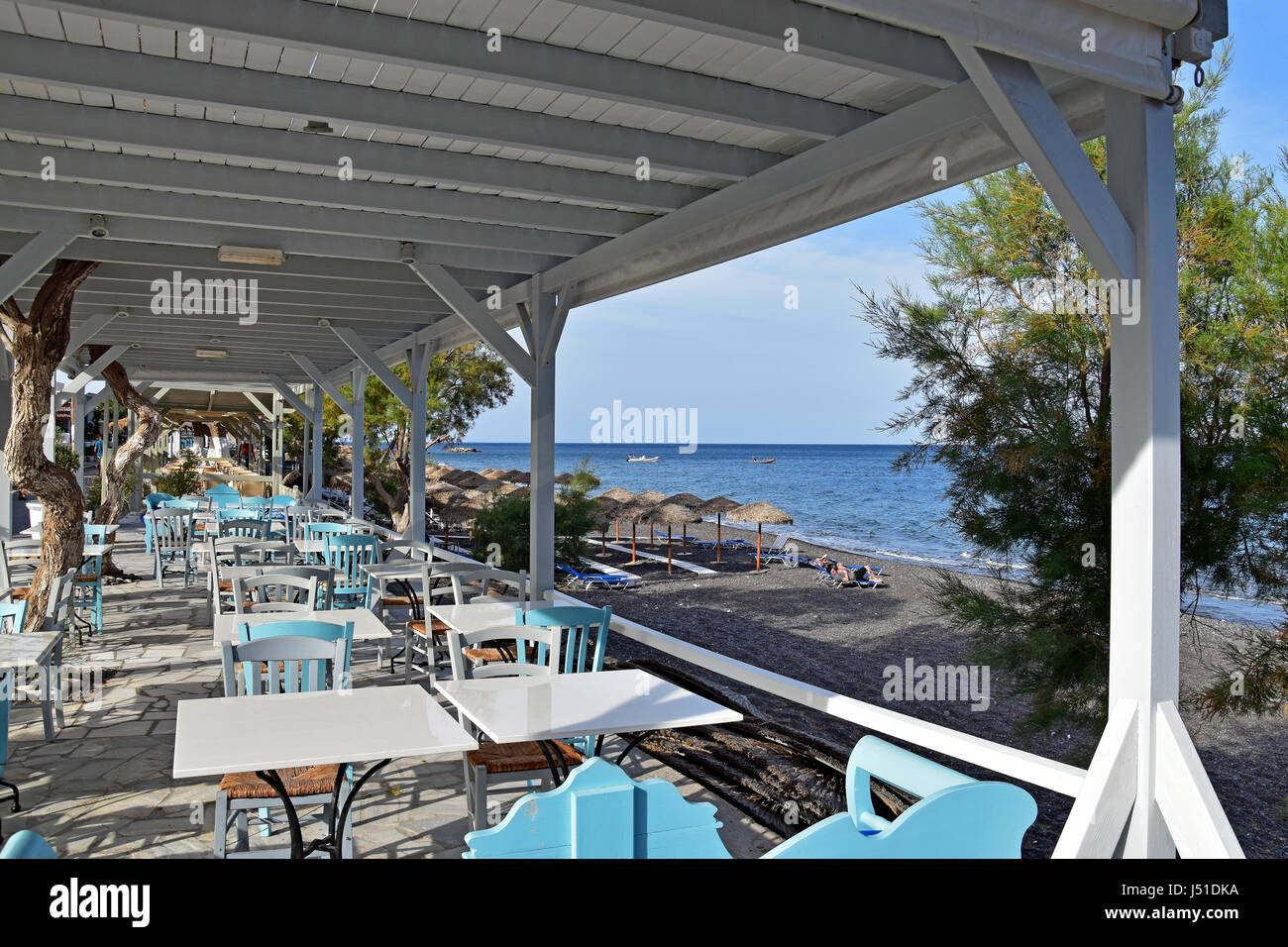 Restaurant overlooking Kamari Beach in Santorini Greece Stock Photo Alamy