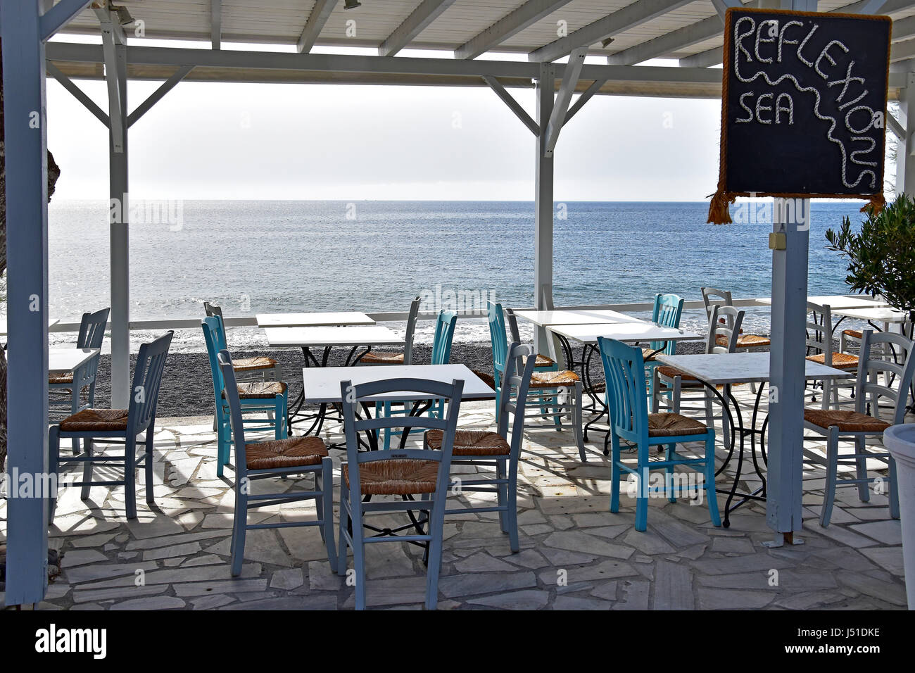 Restaurant overlooking Kamari Beach in Santorini Greece Stock Photo Alamy