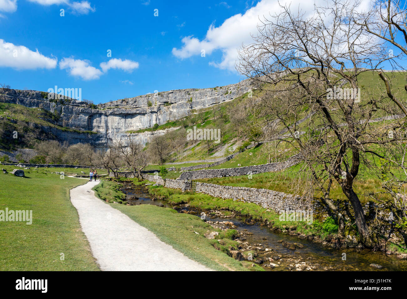 Footpath to Malham Cove alongside Malham Beck, Malham, Malhamdale, Yorkshire Dales National Park, North Yorkshire, England, UK. Stock Photo