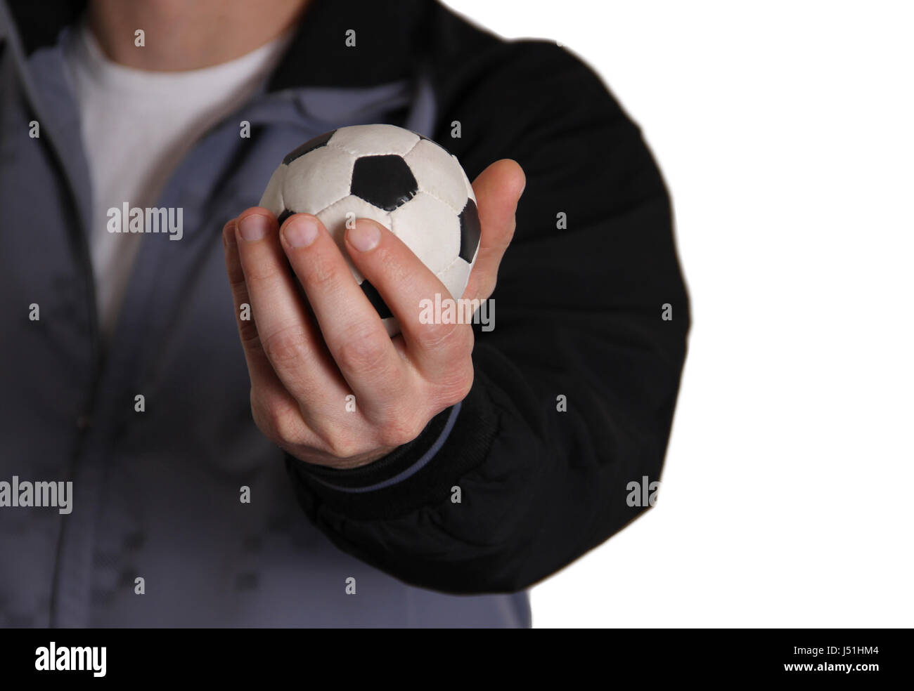 Soccer ball in hand Stock Photo Alamy
