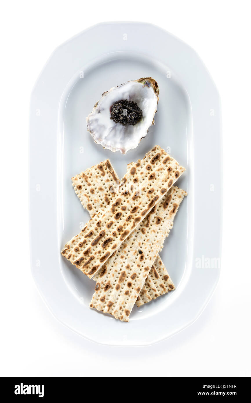 Black sturgeon caviar and matzah on plate, view from above. With clipping path Stock Photo Alamy