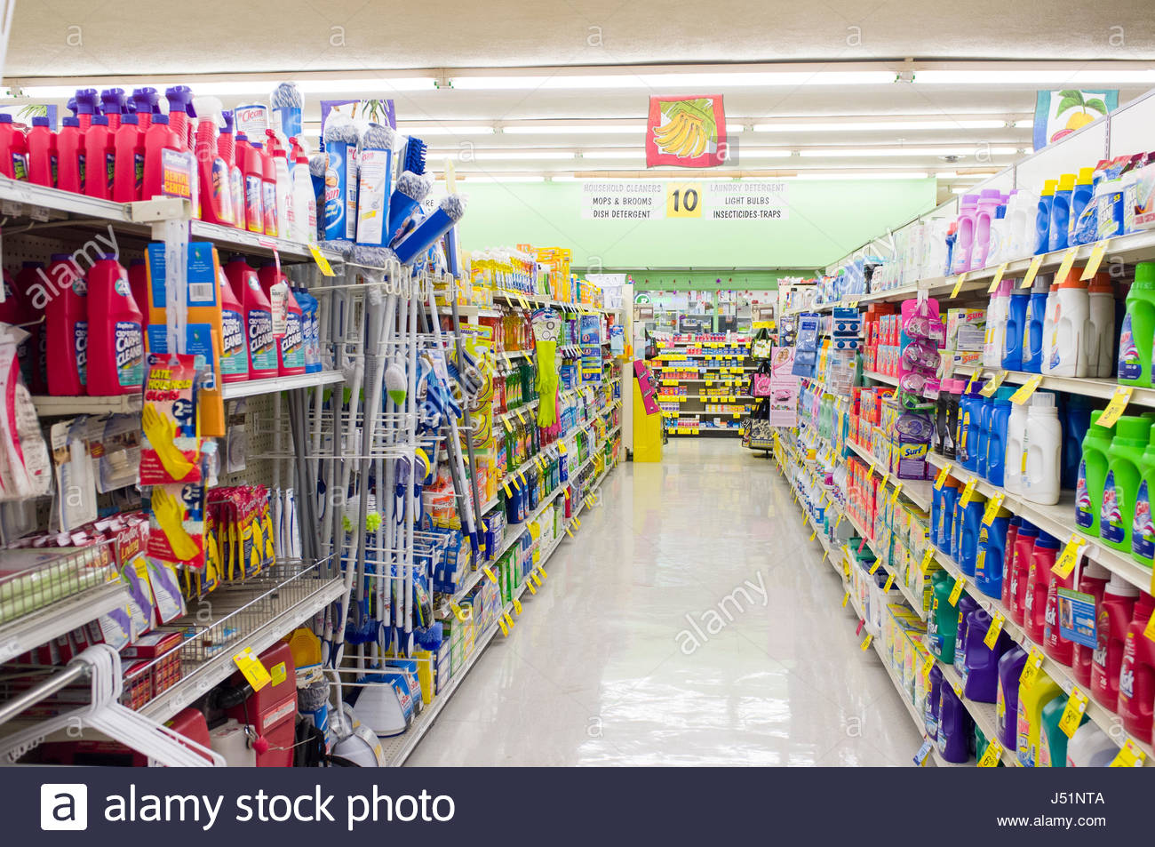 Household cleaning products and supplies on shelves in a grocery Stock