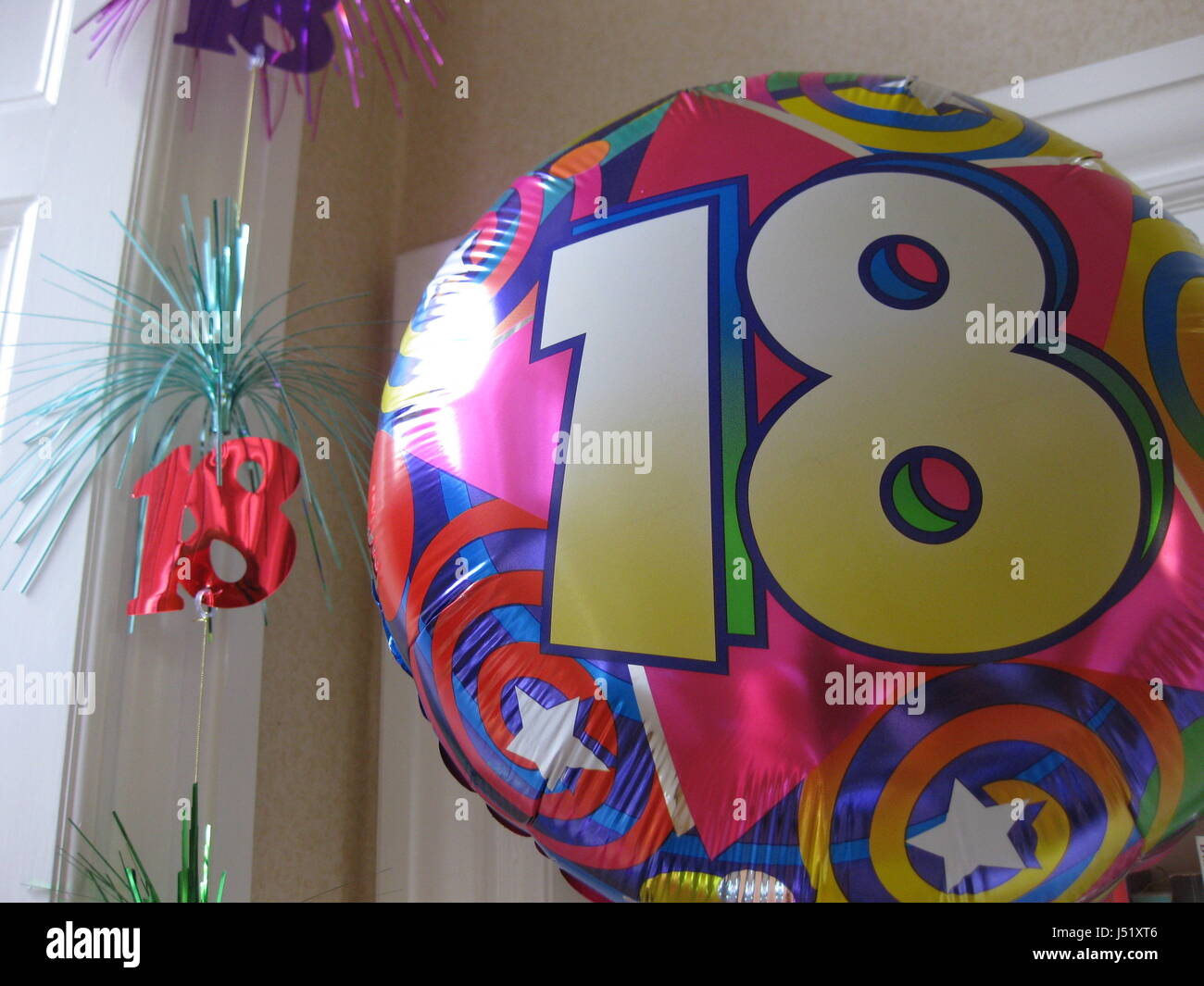 Decorations and balloon for 18th birthday party hanging from ceiling Stock Photo