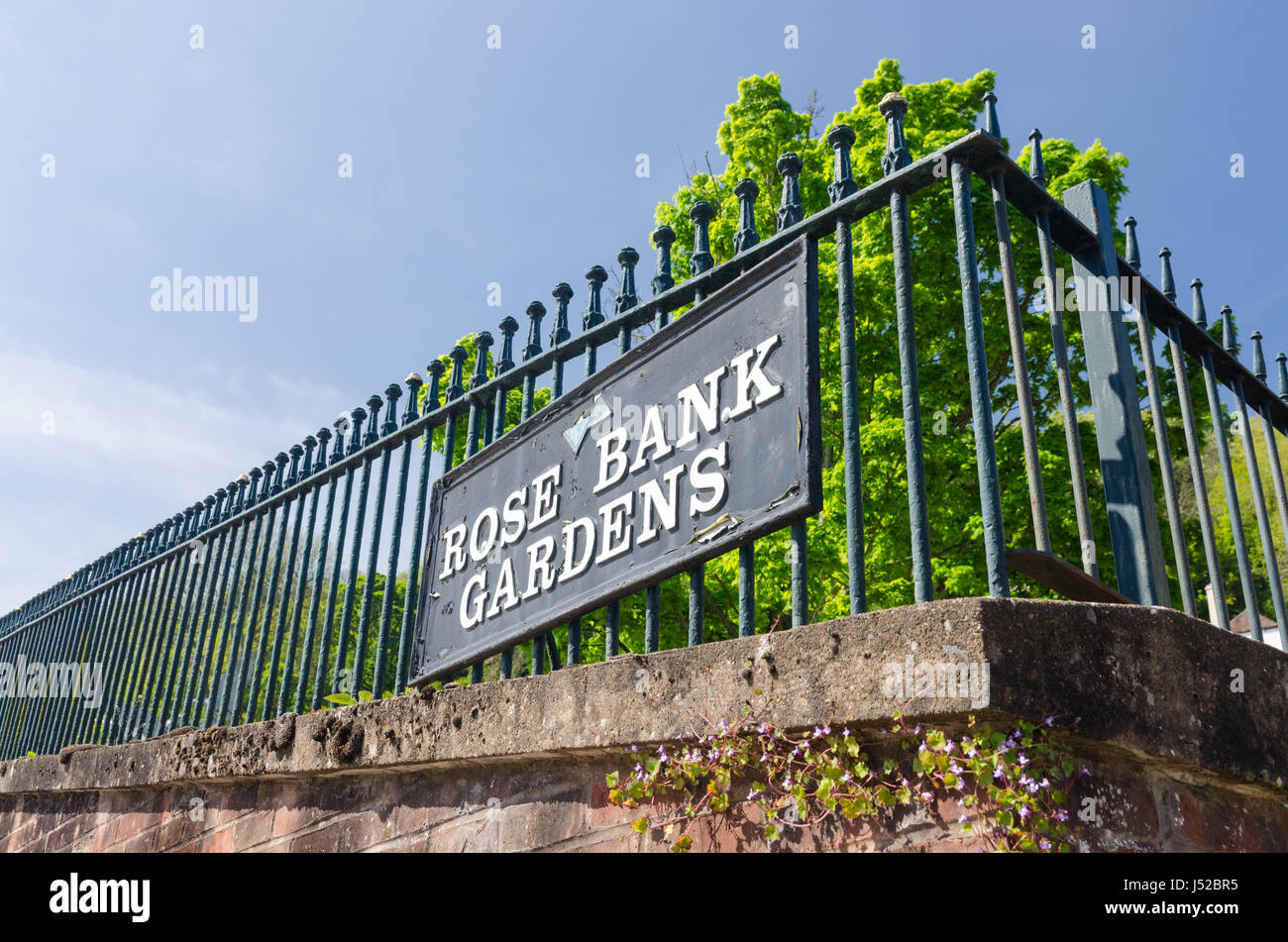 Sign for Rose Bank Gardens on metal railings in Great Malvern, Worcestershire Stock Photo