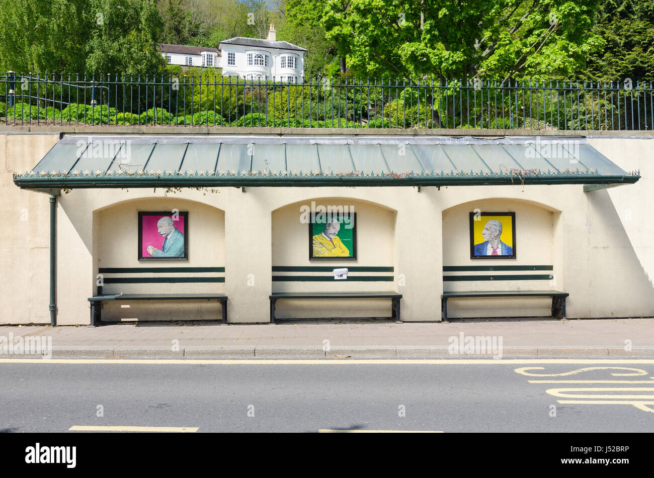 Traditional covered bus stop in Rose Bank Gardens in Great Malvern
