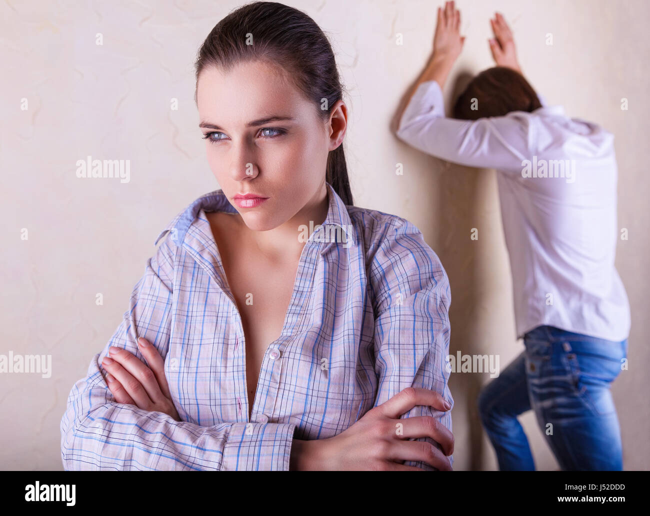 Couple in deep thought after a quarrel. The girl in the foreground Stock Photo