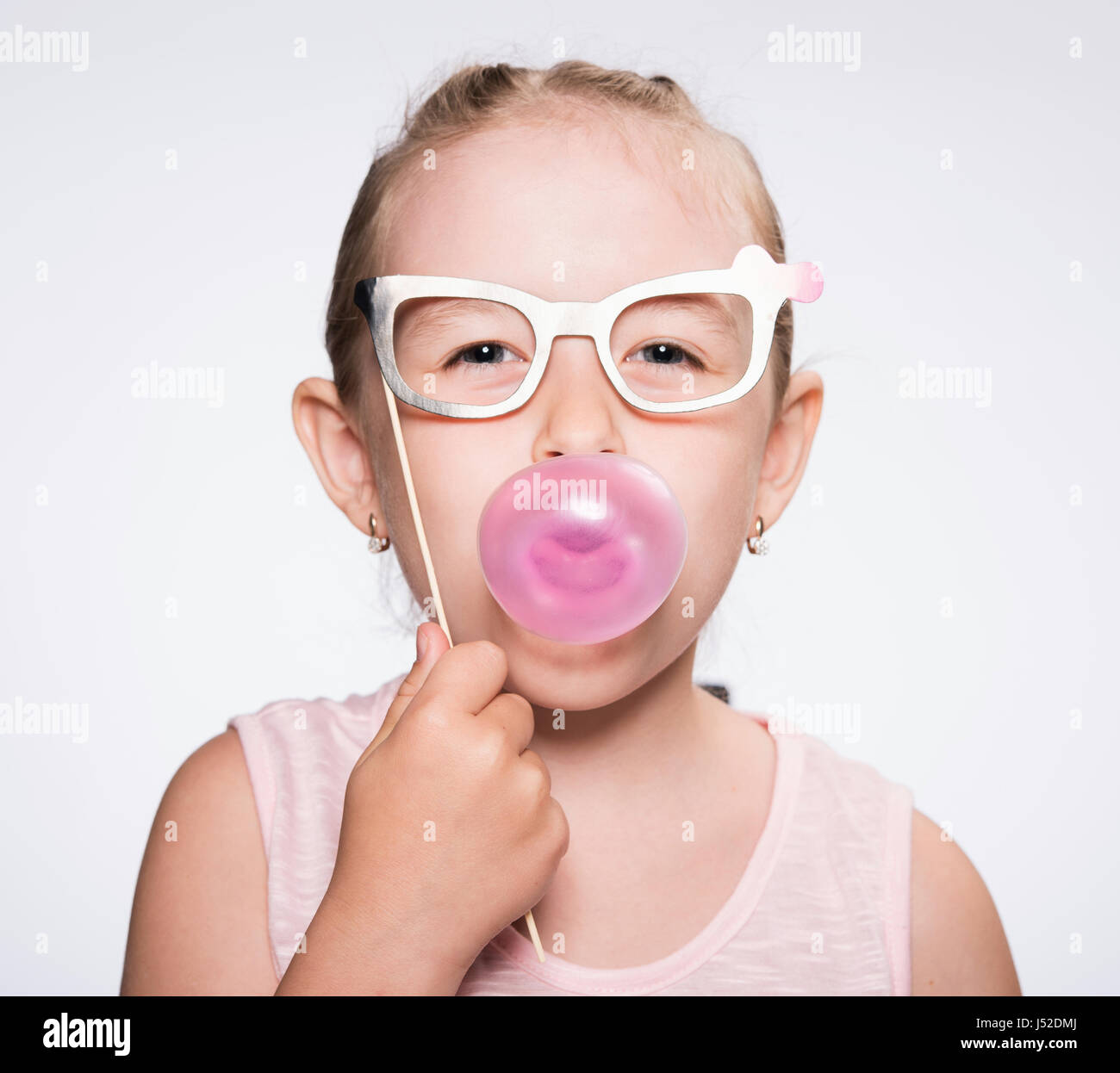 child with inflate the balloon of bubble gum Stock Photo