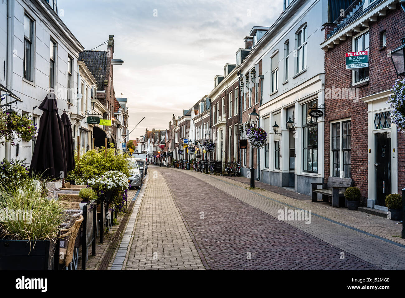 Naarden, Netherlands - August 5, 2016: Picturesque street in Naarden city centre. Naarden was developed into a fortified garrison town with a textile  Stock Photo