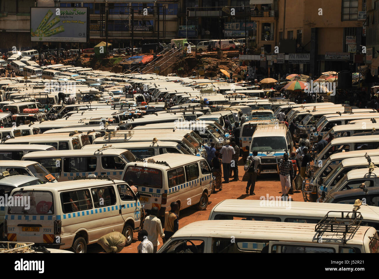 Kampala Taxi rank or park, also known as matatus. They follow relatively pre-set routes all over the city and many over the city and country. Stock Photo