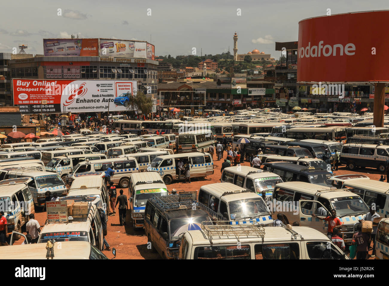 Kampala Taxi rank or park, also known as matatus. They follow relatively pre-set routes all over the city and many over the city and country. Stock Photo