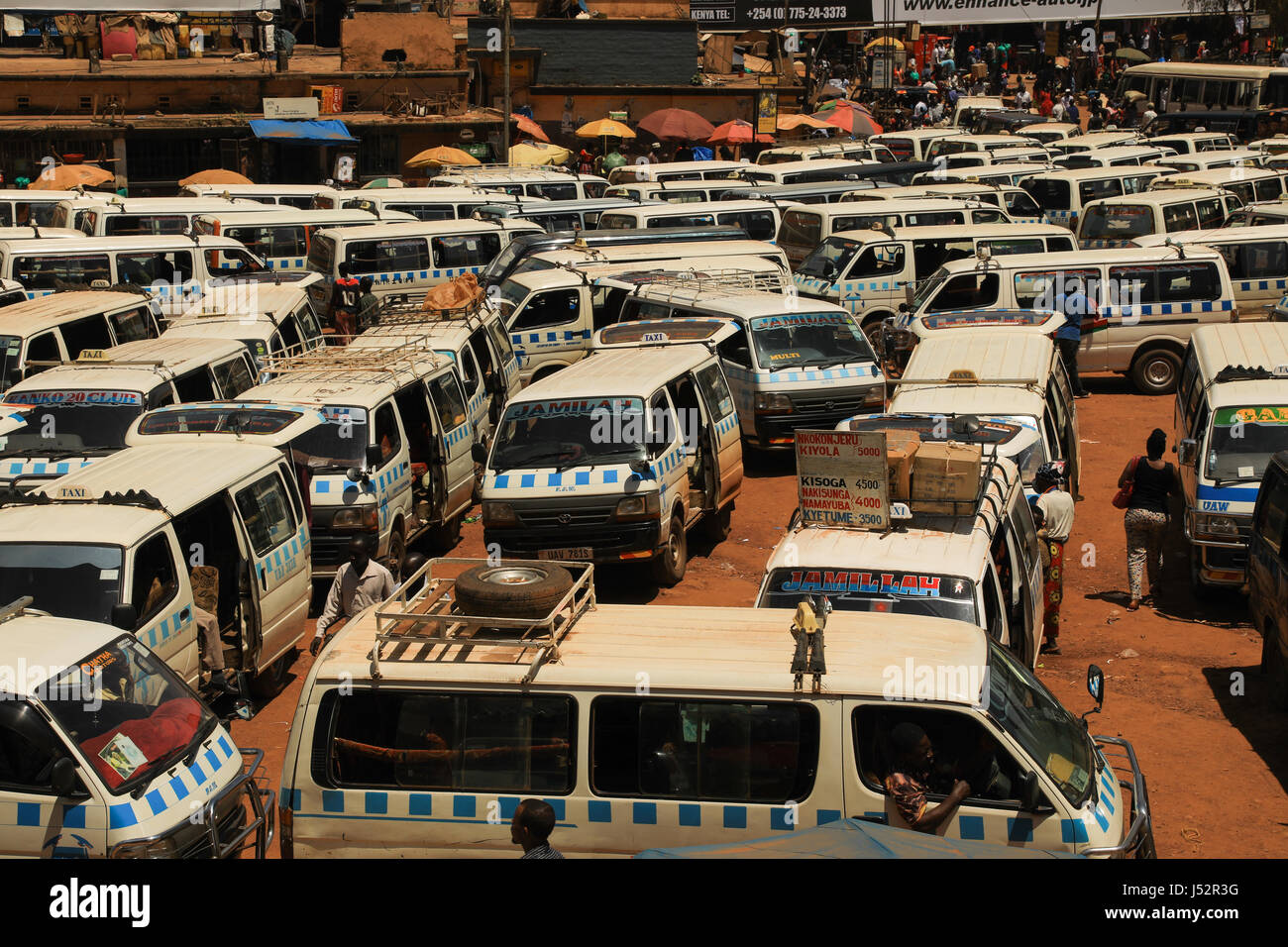 Kampala Taxi rank or park, also known as matatus. They follow relatively pre-set routes all over the city and many over the city and country. Stock Photo