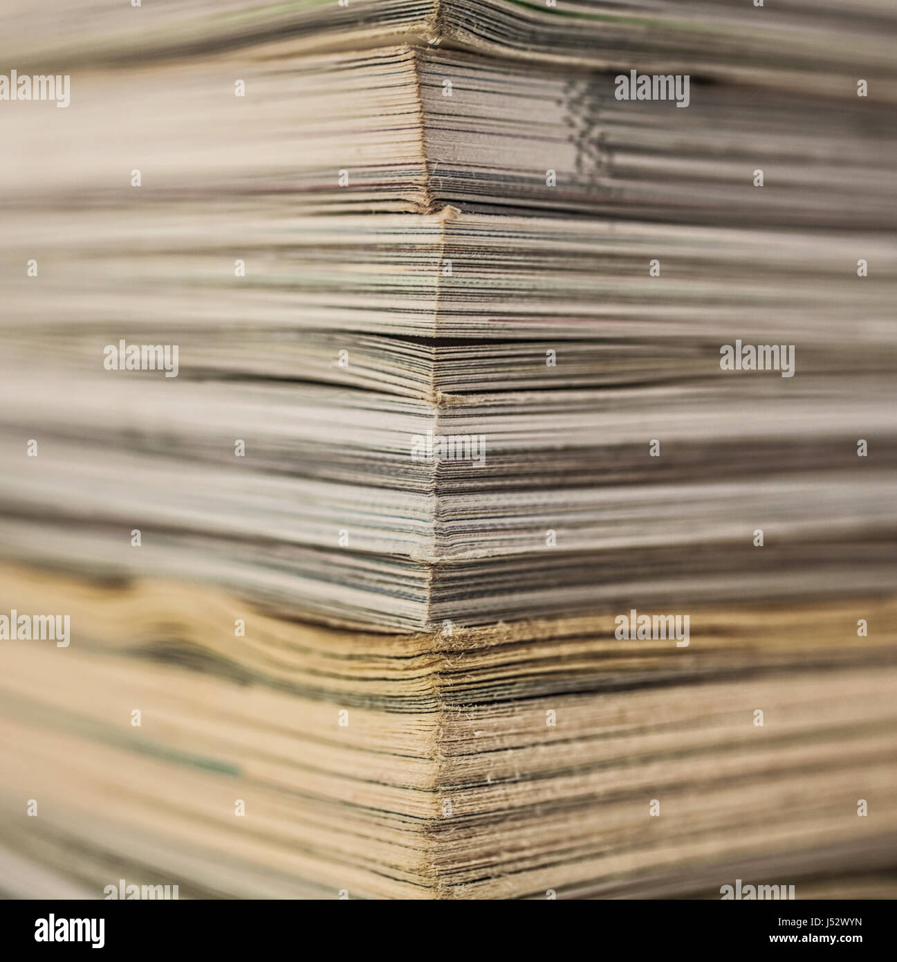 A stack of old magazines macro Stock Photo - Alamy