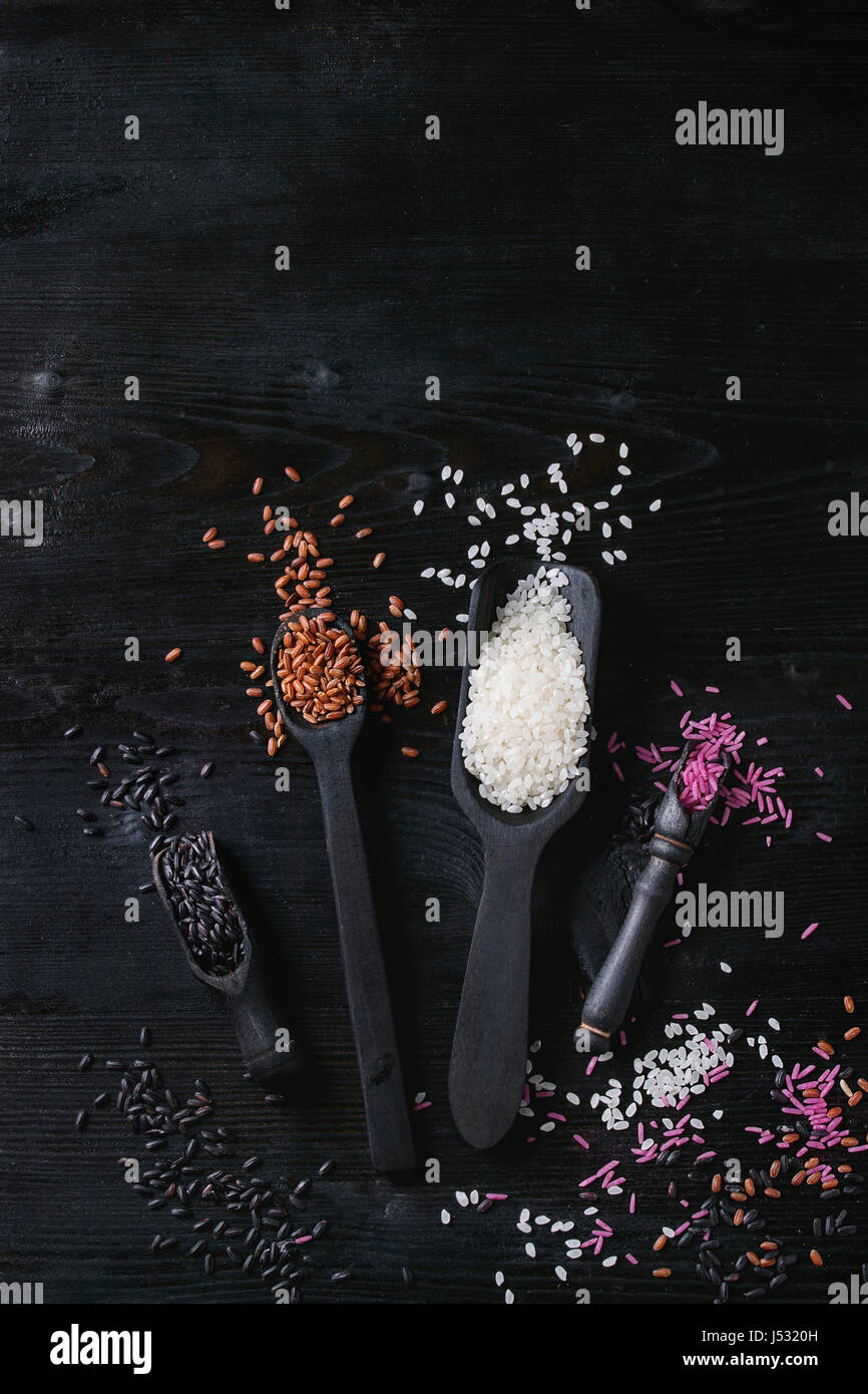Variety assortment of raw uncooked colorful rice white, black, brown ...