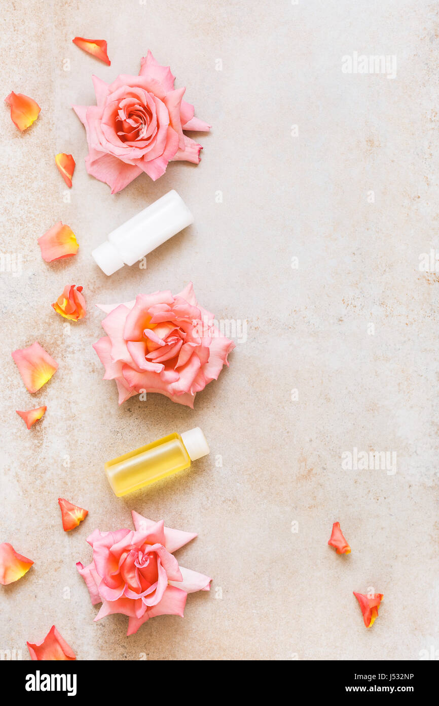 Spa still life with roses  beauty skin care products. Top view, blank space, rustic surface Stock Photo
