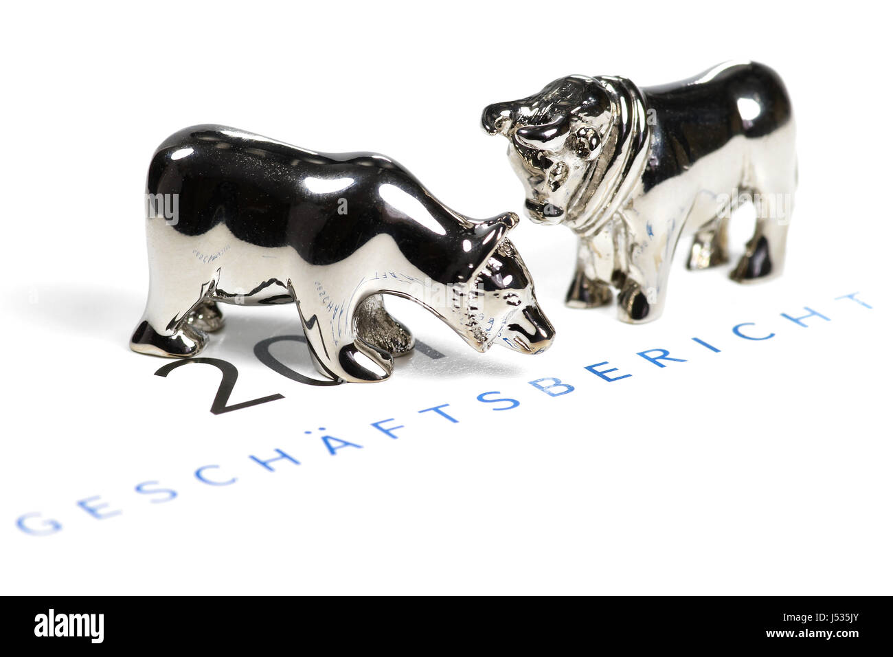 German annual report with bull and bear figures Stock Photo