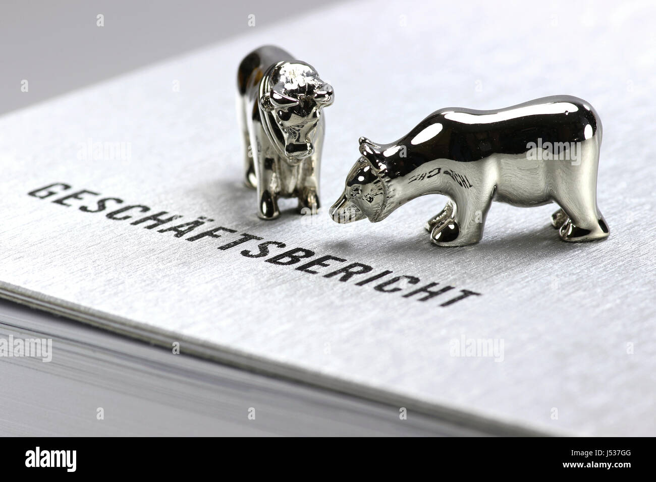 German annual report with bull and bear figures Stock Photo