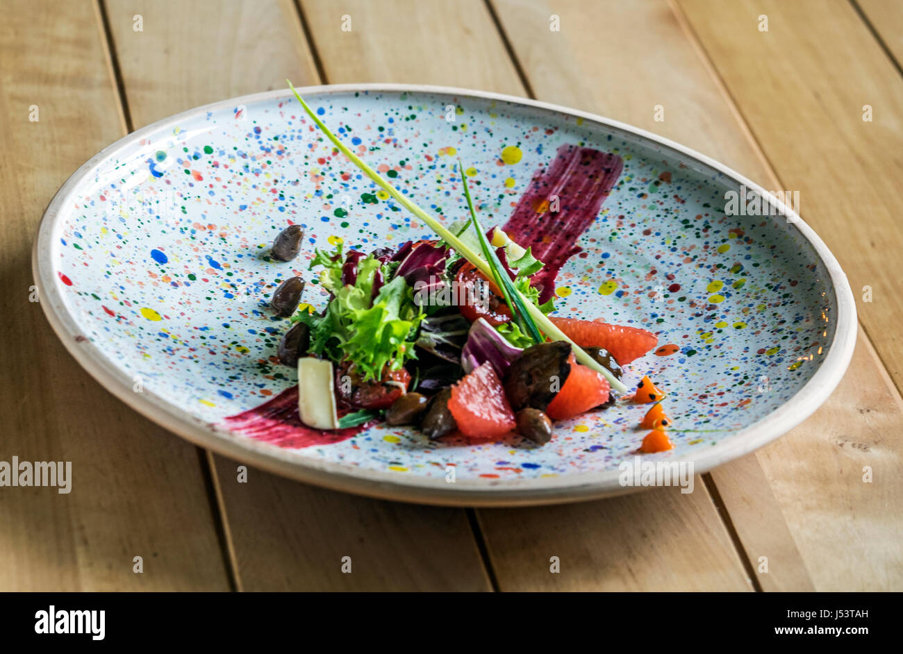 Salad with quail liver and grapefruit. Selective focus Stock Photo Alamy