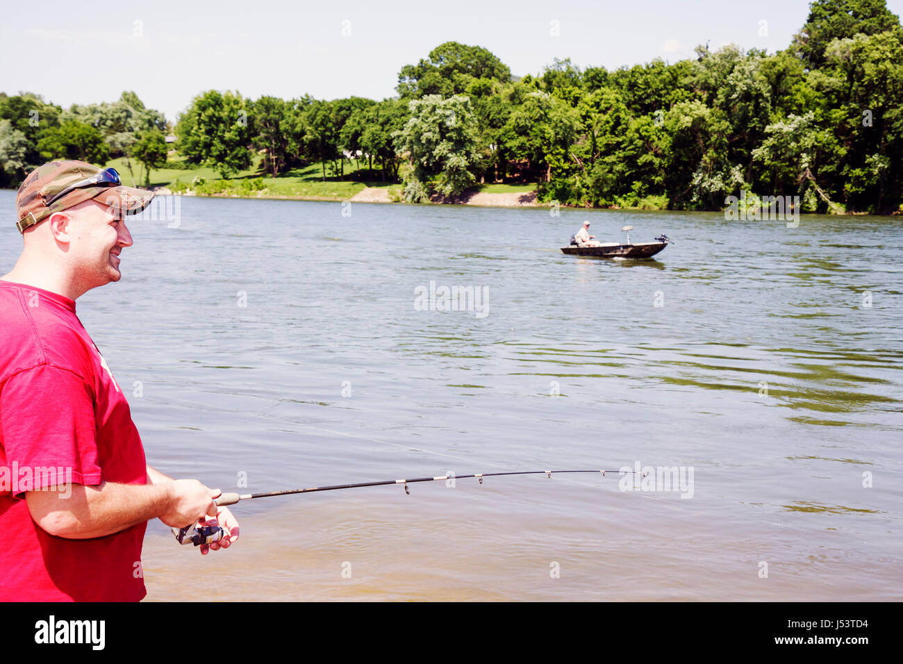 Arkansas Ozark Mountains,Allison,White River water,adult adults man men male,freshwater fishing,angler,shore,boat,rod,reel,recreation,sport,visitors t Stock Photo