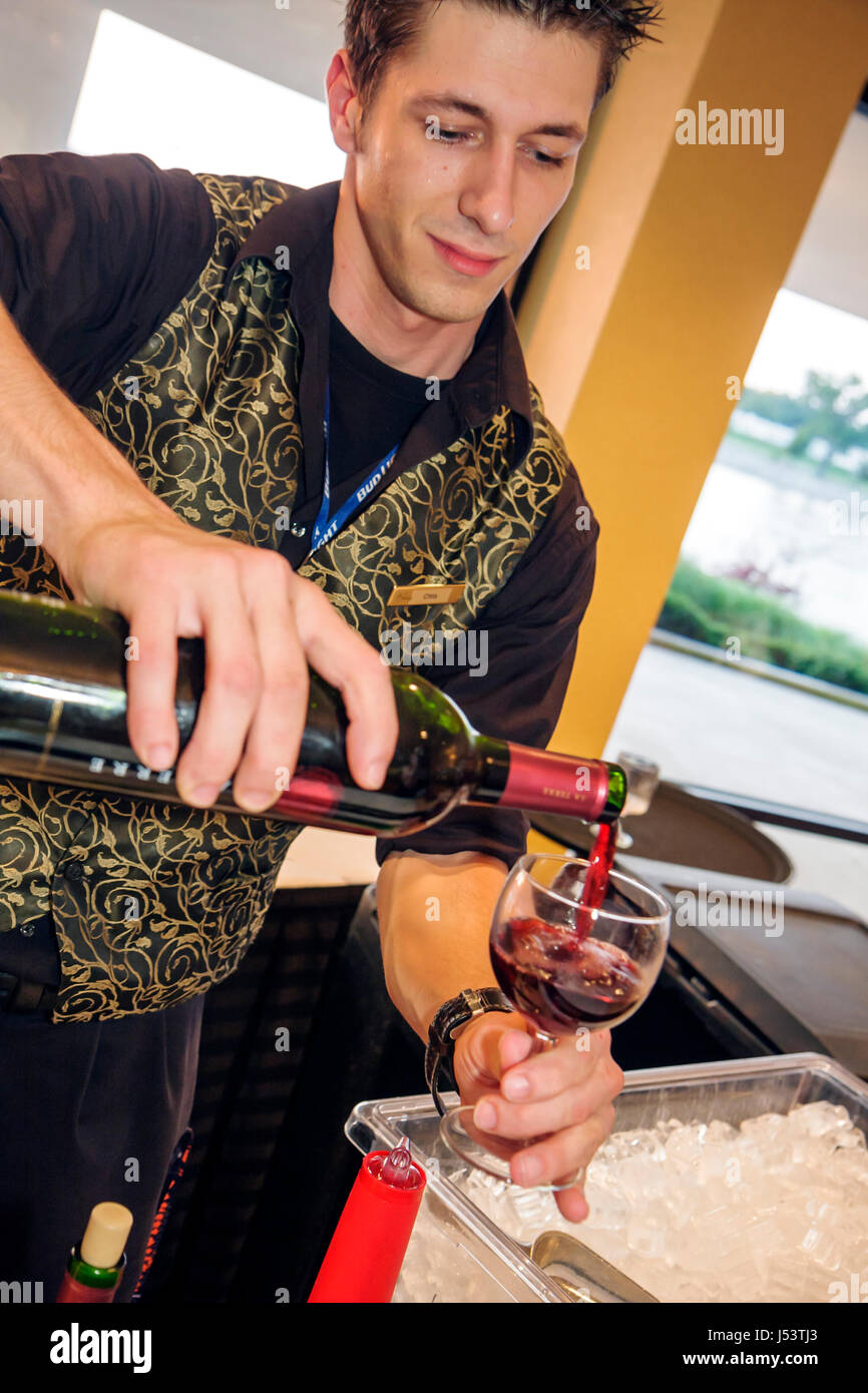 Little Rock Arkansas,Convention Center,centre,bartender,man men male,bottle,red wine,pour glass,beverage,drink drinks,beverage,working,work,employee w Stock Photo