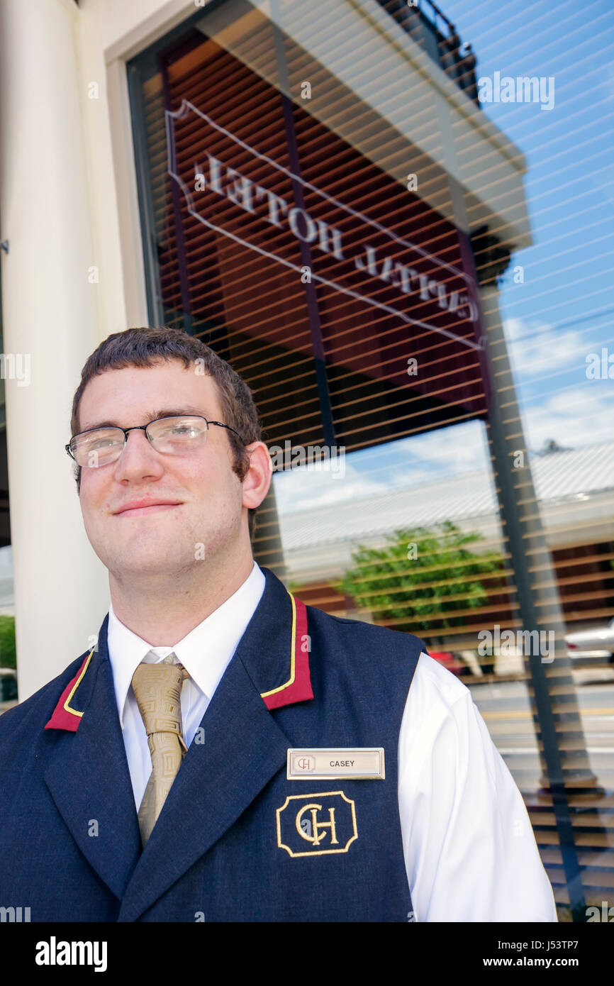 Little Rock Arkansas,Markham Street,Capital,hotel,man men male,young,uniform,porter,working,work,employee worker workers staff,employment,greet,histor Stock Photo