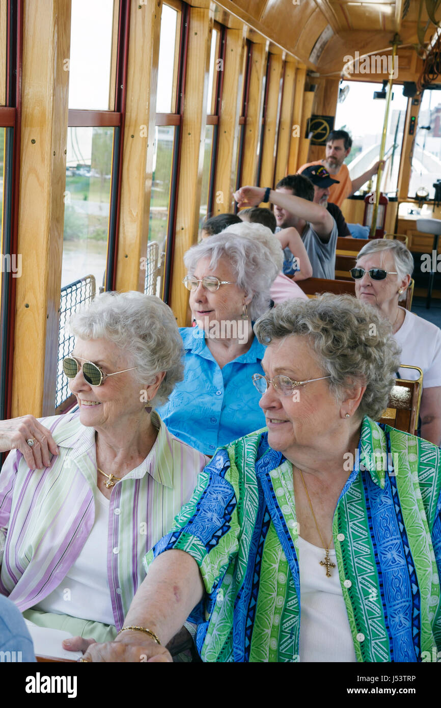 Little Rock Arkansas,River Rail Electric Streetcar,woman female women,senior seniors citizen citizens,tour,heritage streetcar,trolley,replica,light ra Stock Photo