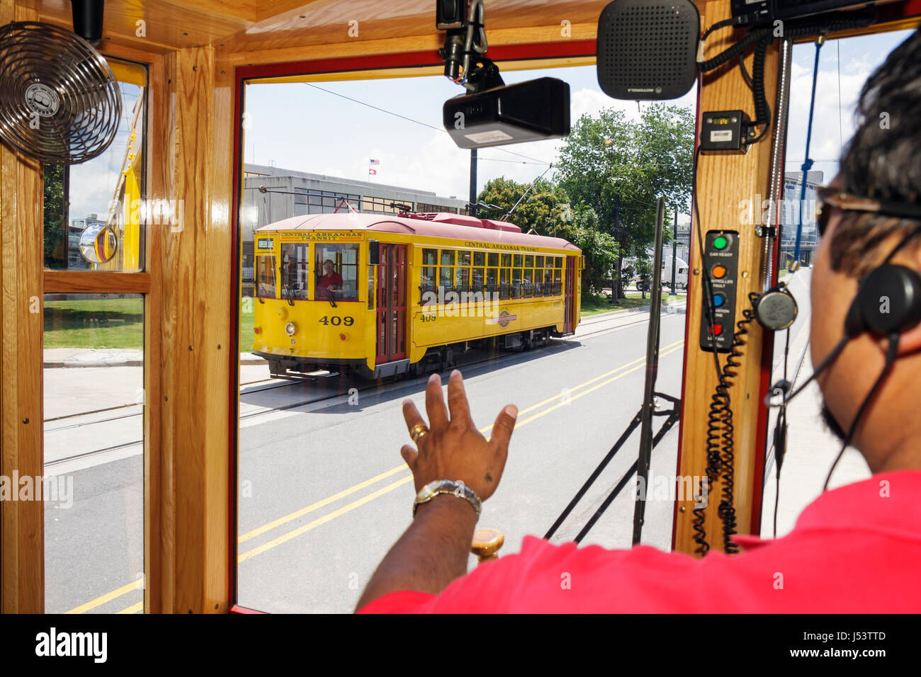 Little Rock Arkansas,River Rail Electric Streetcar,Hispanic man men male,conductor,heritage,trolley,replica,light rail system,downtown red yellow,trac Stock Photo