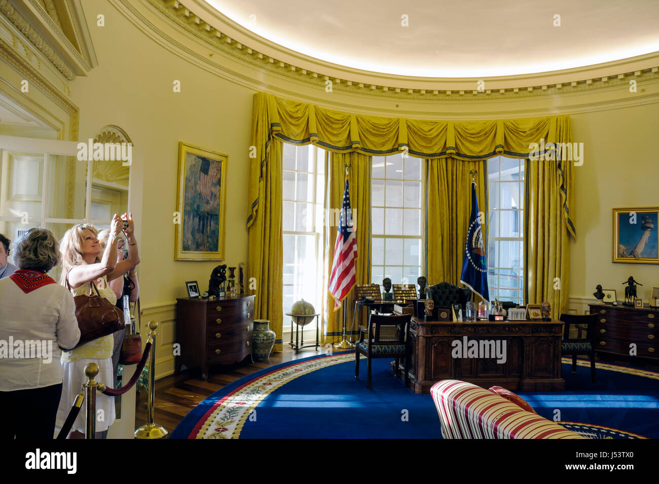 Little Rock Arkansas,William J. Clinton Presidential Library,Oval Office,woman female women,take photo,full scale replica,42nd President,residents,exh Stock Photo