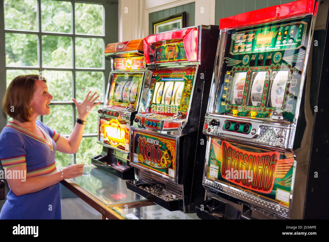 Eureka Springs Arkansas,Ozark Mountains,1905 Basin Park,hotel,slot machine,woman female women,wins,luck,gamble,gambling,fun,AR080609037 Stock Photo