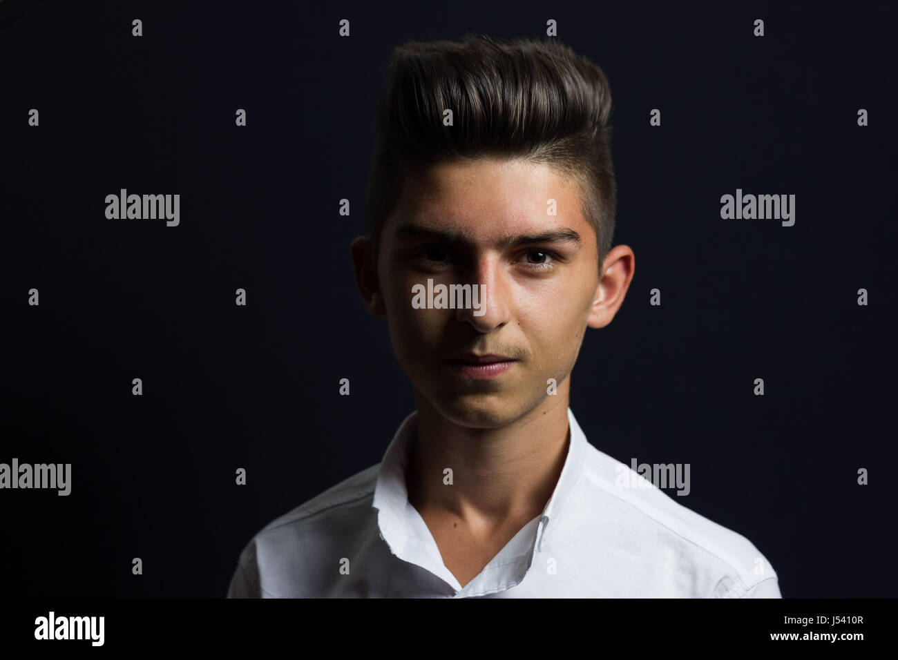 young cute serious teen with stylish haircut Stock Photo - Alamy