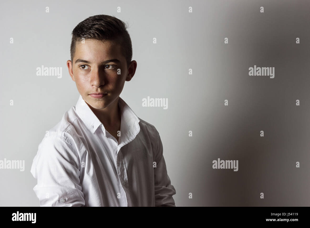 serious young male teenager with shirt Stock Photo