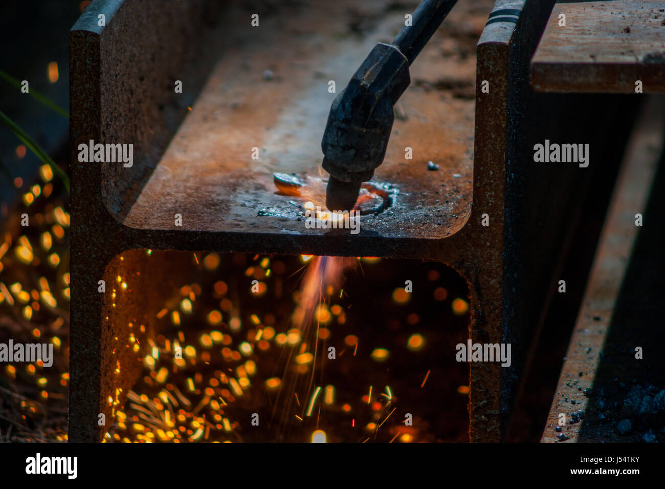 cutting a hole in a steel beam using an acetylene torch Stock Photo Alamy