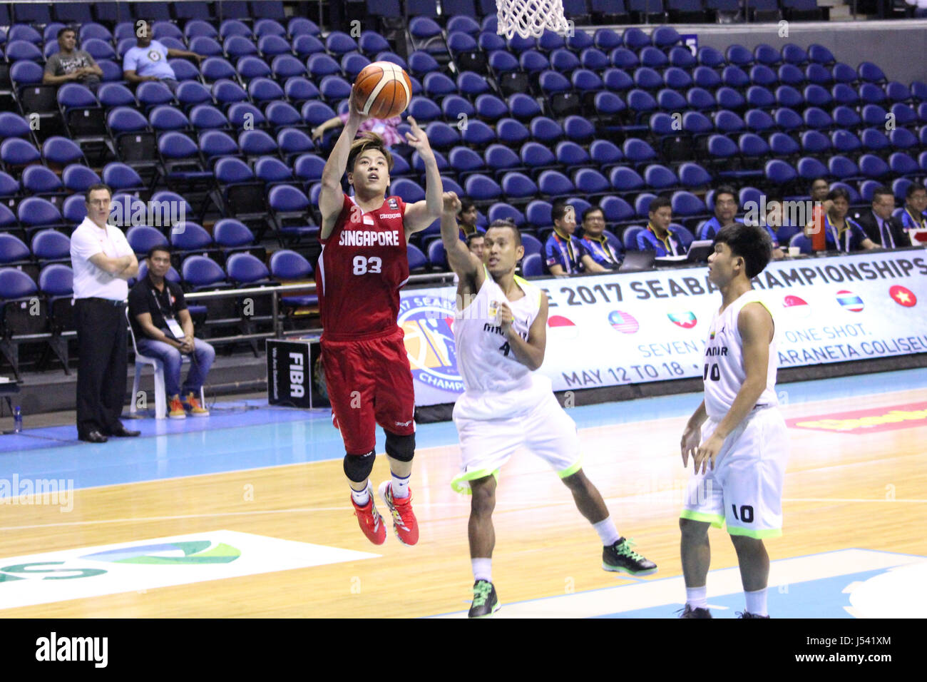 Tan Chin Hong Of Singapore Takes A Jumpshot Over Guard Myat Aung Stock Photo Alamy