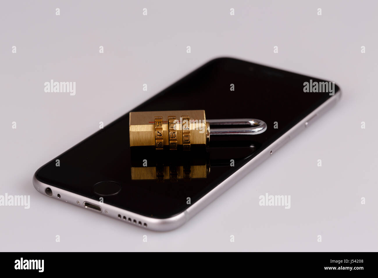 cellphone data security - lock and phone on white Stock Photo