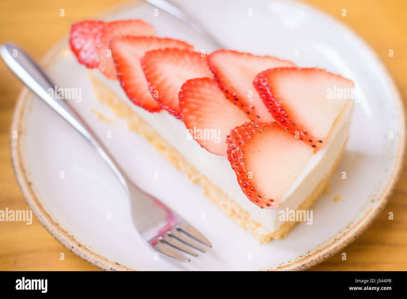Strawberry cake with fork on white plate and strawberry fruit Stock ...