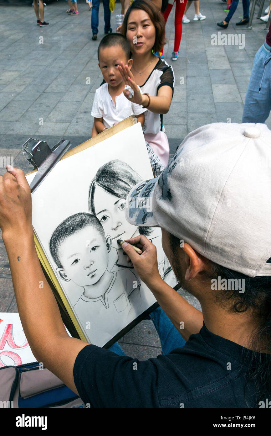 Chinese street artist drawing a portrait, Yinchuan, Ningxia, China