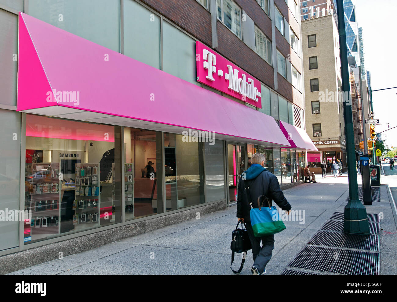 New York, May 08, 2017: People walk by a T-Mobile retail store in Manhattan. Stock Photo